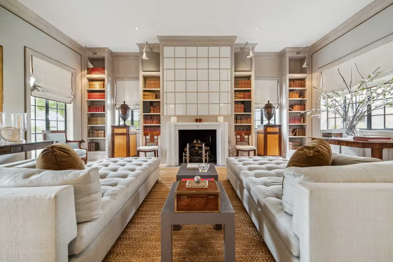 Spacious living room in Joel Osteen’s mansion featuring a wood-burning fireplace
