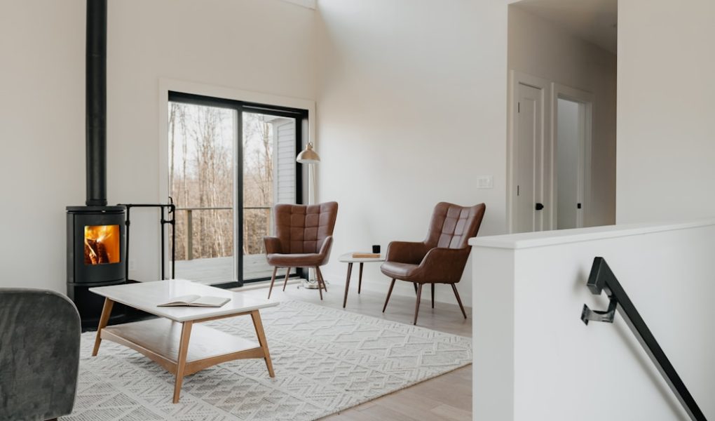 a living room filled with furniture and a fire place