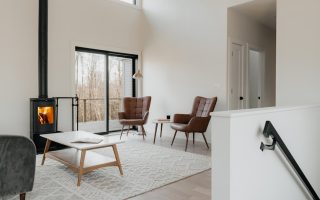 a living room filled with furniture and a fire place