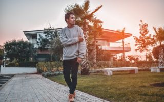 man walking on pathway during golden hour