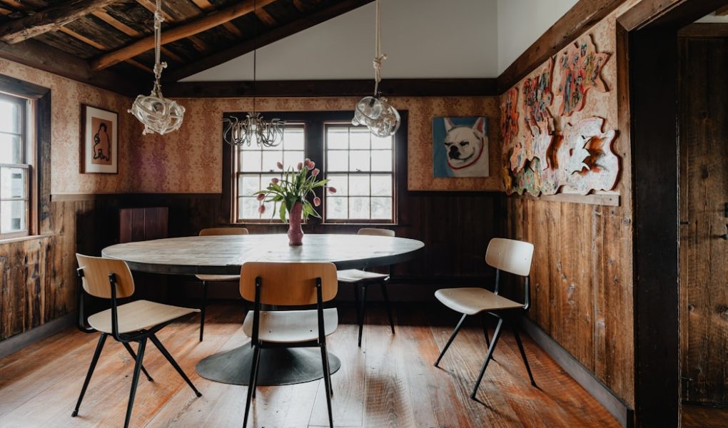 a dining room with a table and chairs