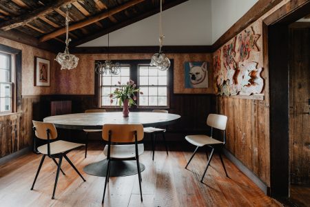 a dining room with a table and chairs