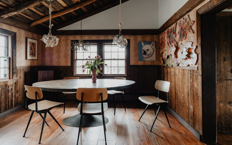 a dining room with a table and chairs