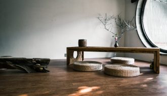 brown wooden bench near window