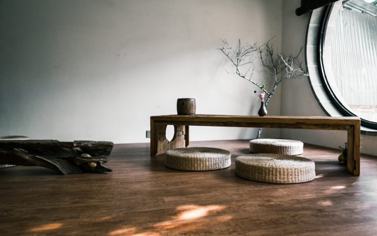 brown wooden bench near window