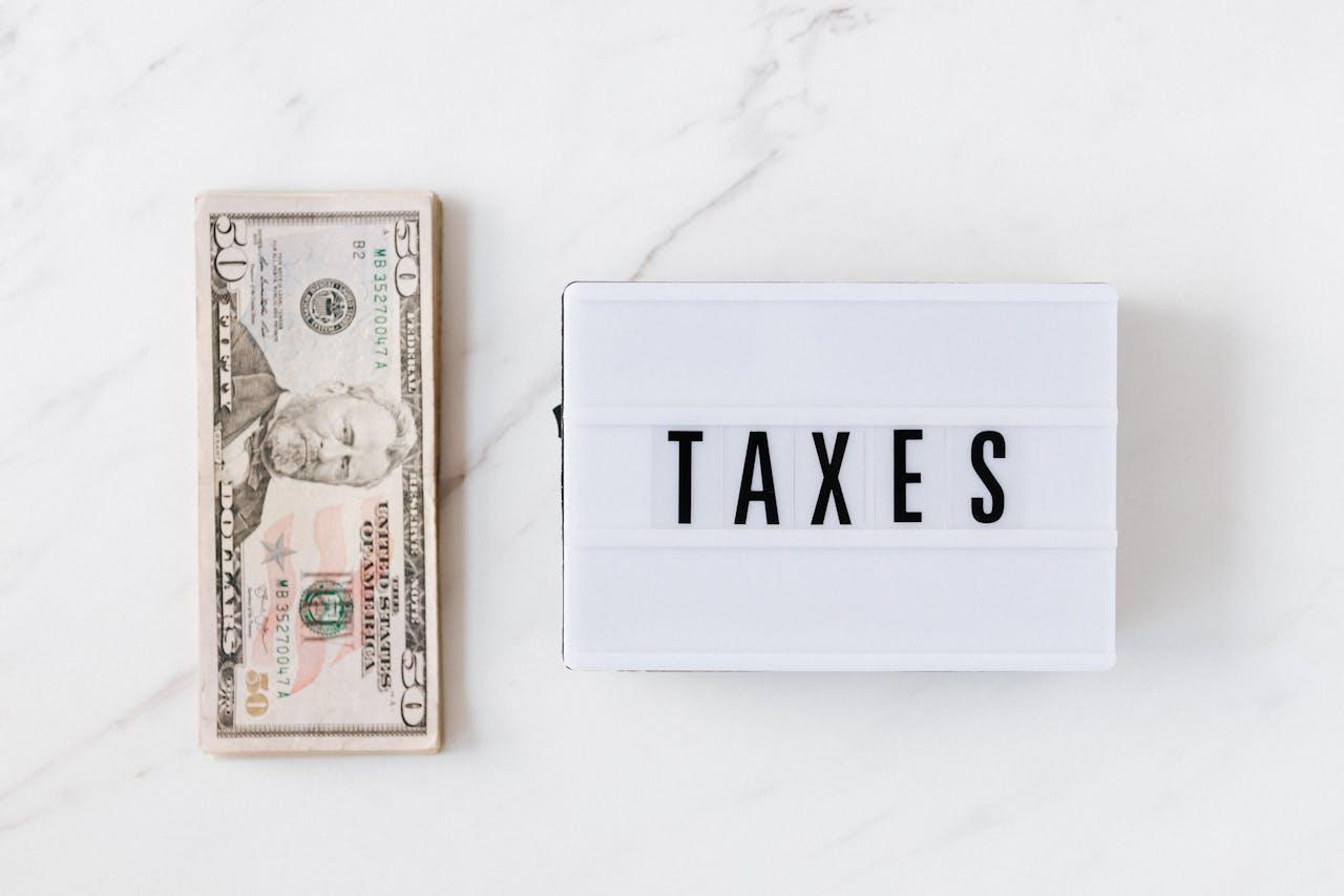 American dollar bills and a light box with an inscription