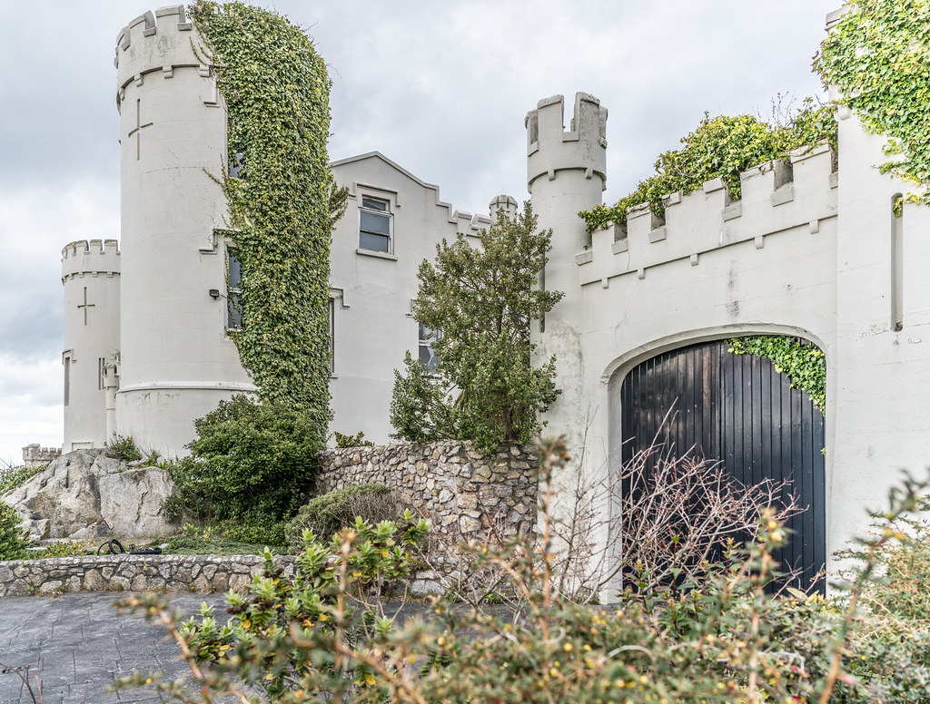 Ayesha Castle in Killiney, Dublin, restored after the 1928 fire, with ivy climbing its turreted walls.