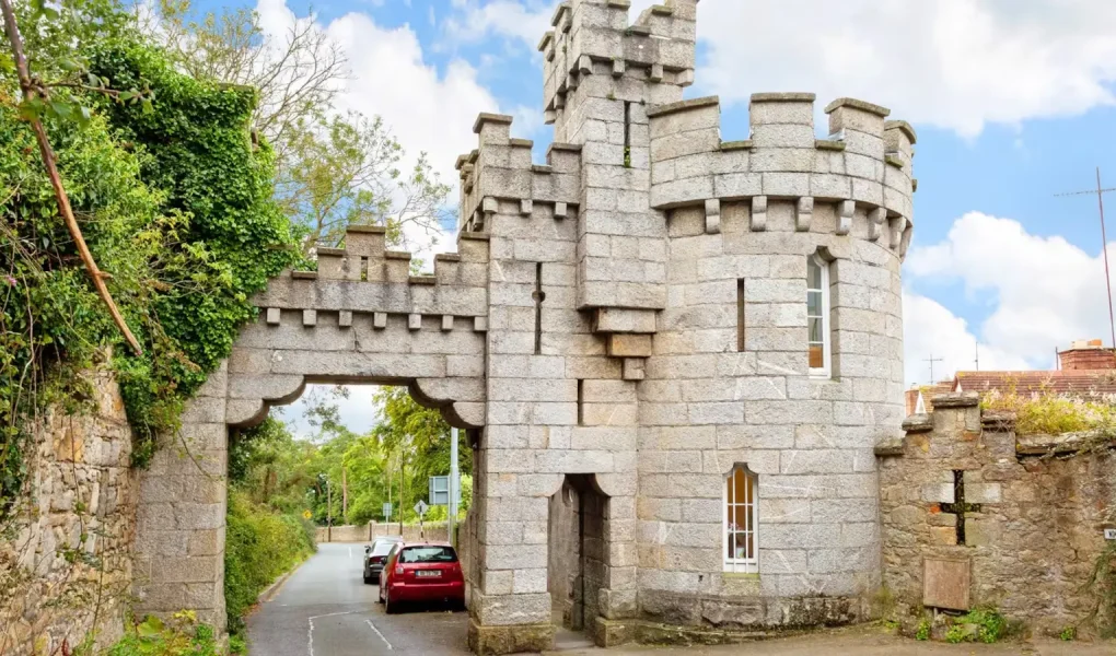 Manderley Castle exterior view with turret overlooking Killiney Bay.
