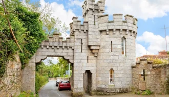 Manderley Castle exterior view with turret overlooking Killiney Bay.