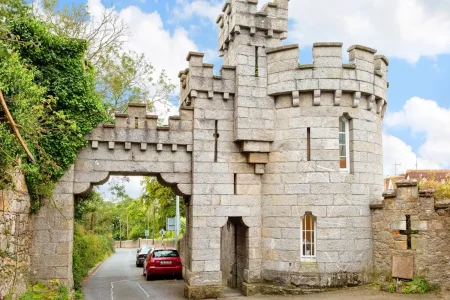 Manderley Castle exterior view with turret overlooking Killiney Bay.