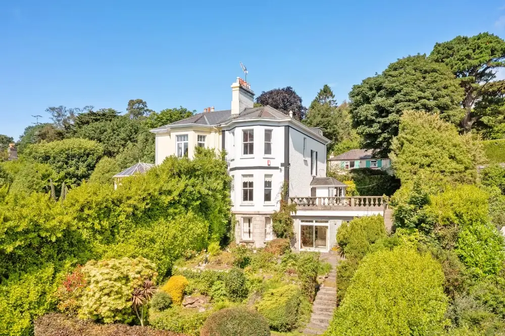 Bono’s seaside villa in Killiney, Dublin, surrounded by lush gardens and overlooking the Irish Sea.